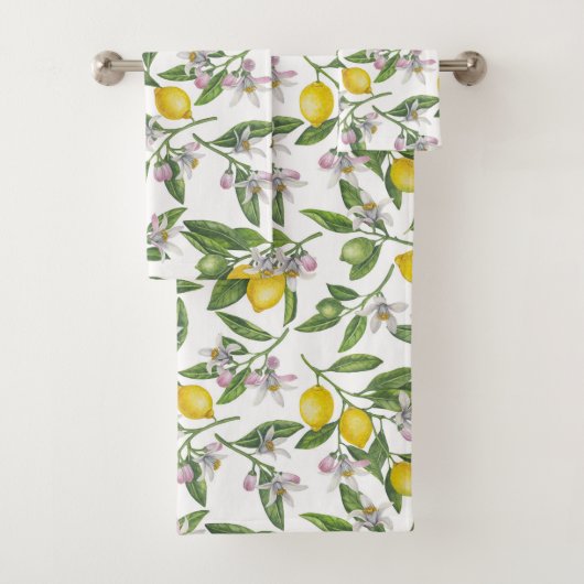 Lemon branches with blossoms and fruit on white bad handdoek (Insitu)