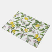 Lemon branches with blossoms and fruit on white deurmat (Schuin)