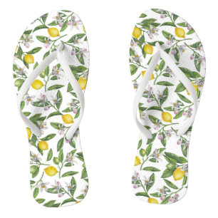Lemon branches with blossoms and fruit on white teenslippers