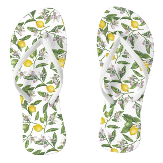 Lemon branches with blossoms and fruit on white teenslippers (Voetbed)