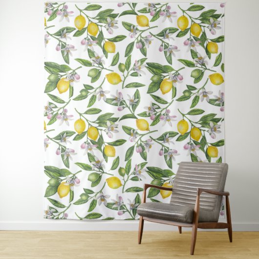 Lemon branches with blossoms and fruit on white wandkleed (In situ)