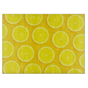 Lemon snijdt glazen plaat van citrusvruchten snijplank