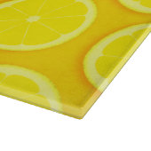 Lemon snijdt glazen plaat van citrusvruchten snijplank (Hoek)