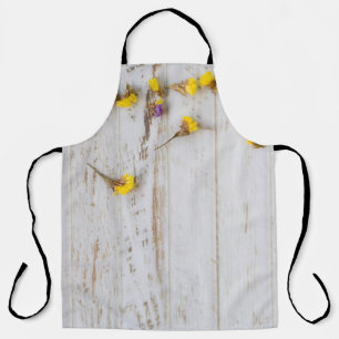 Lente gele bloemen, witte plank decor. schort