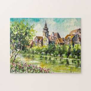 Lente in kleine stad op de rivier legpuzzel