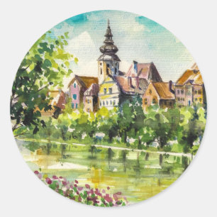Lente in kleine stad op de rivier ronde sticker