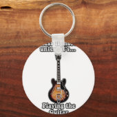 Less is more unless it's playing the guitar. brown sleutelhanger (Voorkant)