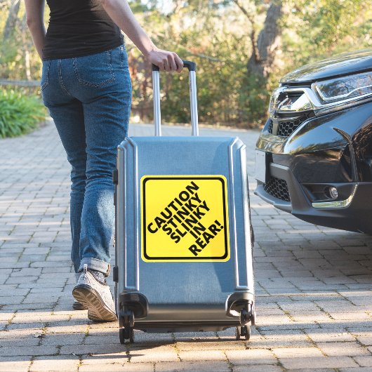 Let op Stinky Slinky achterin! Sticker (Koffer Insitu)