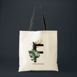 Letter F Monogram | Tropisch monstera op maat Tote Bag<br><div class="desc">letter F monogram canvas tas met waterverf montera leaf,  faux goudfolie en zwarte waterverf borstelaccenten. Pas deze tropische monogram canvas tas aan door jouw naam of andere details toe te voegen. Deze boho letter F monogrammed canvas tas zal perfect zijn als geschenk. Andere brieven zijn beschikbaar.</div>
