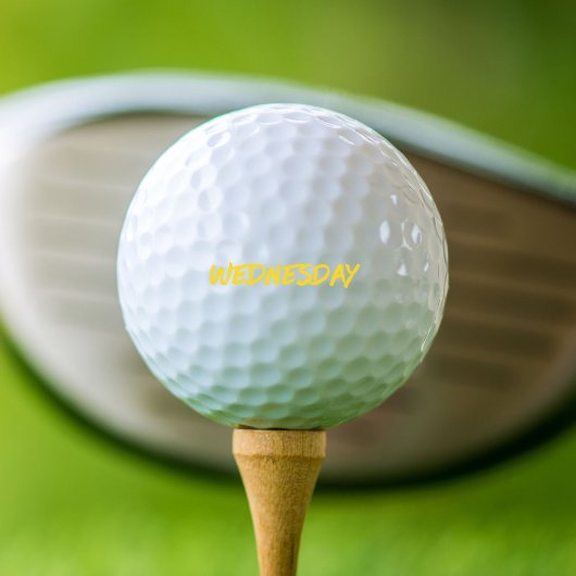 Lettering Design ‘woensdag’ in het geel Golfballen