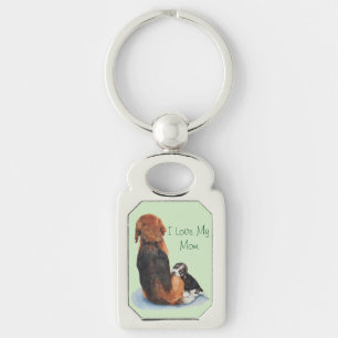 Leuk afbeelding van puppy hond knuffelen moeder sleutelhanger