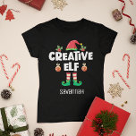 Leuk Creatief elf met naam Kerstmis familie T-shirt<br><div class="desc">Dit leuke T-shirt is ideaal voor elke kerstfamiliebijeenkomst en is voorzien van een schattig elf-pet en kleine poten, met het bijschrift "Creative elf" in een hedendaags wit all-petten lettertype. Dit hilarische zelf-ironische vrolijke elf t-shirt, dat deel uitmaakt van een bijpassend familie elf kleding collectie met cadeaus voor elk familielid, zal...</div>