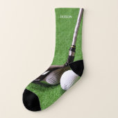 Leuke golfclub en bal op groen sokken (Links - buitenkant)