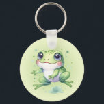 Leuke groene kikker Cartoon Sleutelhanger<br><div class="desc">Een leuk groen kikker cartoon ontwerp net op tijd voor de nationale kikkermaand. De lichtgele groene gradiënt achtergrond digitale afbeelding kan worden verwijderd als u wilt effen wit of een andere kleur. Voeg tekst toe om deze sleutelhanger te personaliseren. Als u hulp nodig hebt bij het overbrengen van het ontwerp...</div>