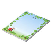 Leuke lieveheersbeestje op lichtblauw notitieblok (Linkerzijde)