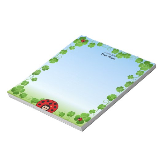 Leuke lieveheersbeestje op lichtblauw notitieblok (Linkerzijde)