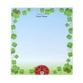 Leuke lieveheersbeestje op lichtblauw notitieblok (Voorkant)