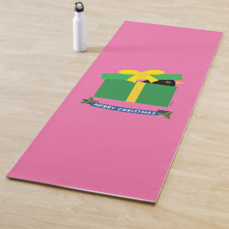 Leuke merel gluren uit een geschenkdoos yogamat