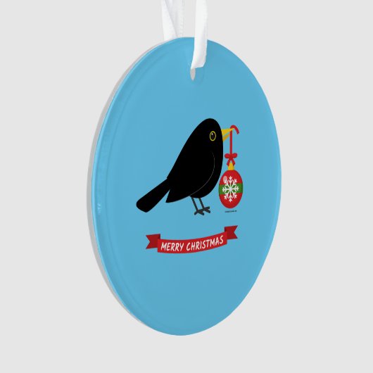 Leuke merel met een kerstbal ornament (voorkant)