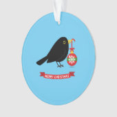 Leuke merel met een kerstbal ornament (voorkant)