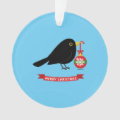 Leuke merel met een kerstbal ornament (voorkant)