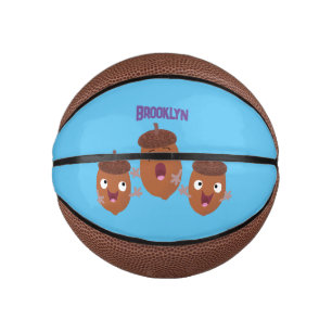 Leuke vrolijke eikels zingen cartoon voor kinderen basketbal