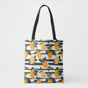 Levendig citrusvruchtenpatroon met groene bladeren tote bag