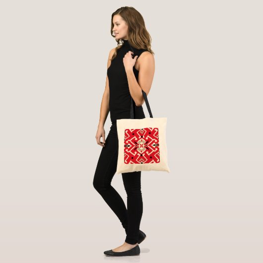 Levendig ikat patroon in rood, wit en zwart tote bag (Voorkant (model))