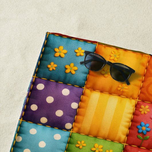 Levendig kleurrijk patchwork quilt patroon strandlaken (In situ)