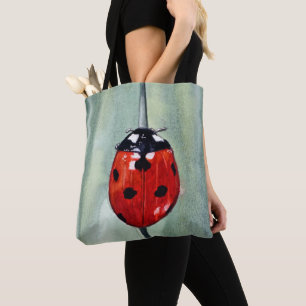 Levendig lieveheersbeestje op groene achtergrond, tote bag