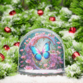 Levendige Blauwe Vlinder op Floral Decorated Lette Sneeuwbol (Kerstmis)
