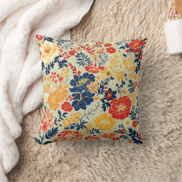 Levendige flora rood, geel en blauw op wit kussen