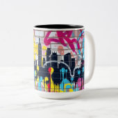 Levendige, met spuiten beschilderde skyline van de tweekleurige koffiemok (Voorkant rechts)