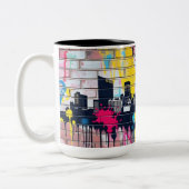 Levendige, met spuiten beschilderde skyline van de tweekleurige koffiemok (Links)