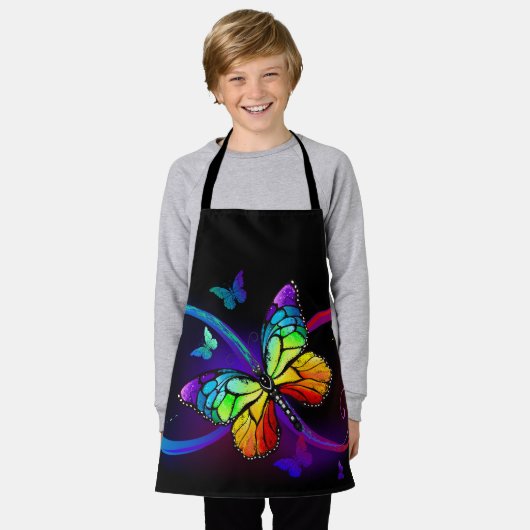 Levendige oneindigheid met regenboogvlinder op zwa schort (Gedragen)