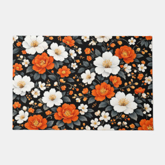 Levendige oranje en witte bloemen op zwart  deurmat