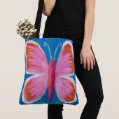 Levendige roze vlinder op blauwe achtergrond tote bag (Dichtbij)