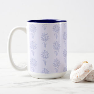 Lichtblauw omlijnd bloempatroon tweekleurige koffiemok