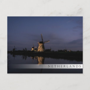 Lichte windmolen bij briefkaart met blauw-uurstang