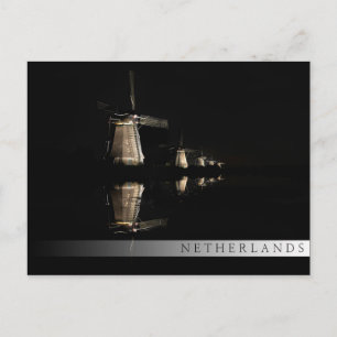 Lichte windmolens bij briefkaart in de nachtbar