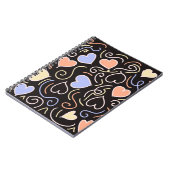 Lichtgekleurde harten op een zwarte achtergrond no notitieboek (Linkerzijde)