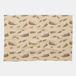 Lichtgekleurde kiezelstenen verspreid over zand theedoek