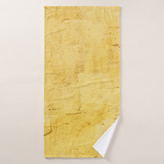 lichtgele abstracte getextureerde pleister op de w badhanddoek