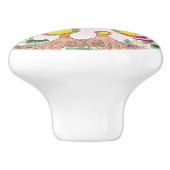 Lichtroze uil op de keramische knol van de groene  keramische knop (Zijkant)