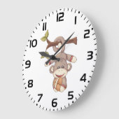 Lief aapje hangend met voetbal grote klok (Hoek)