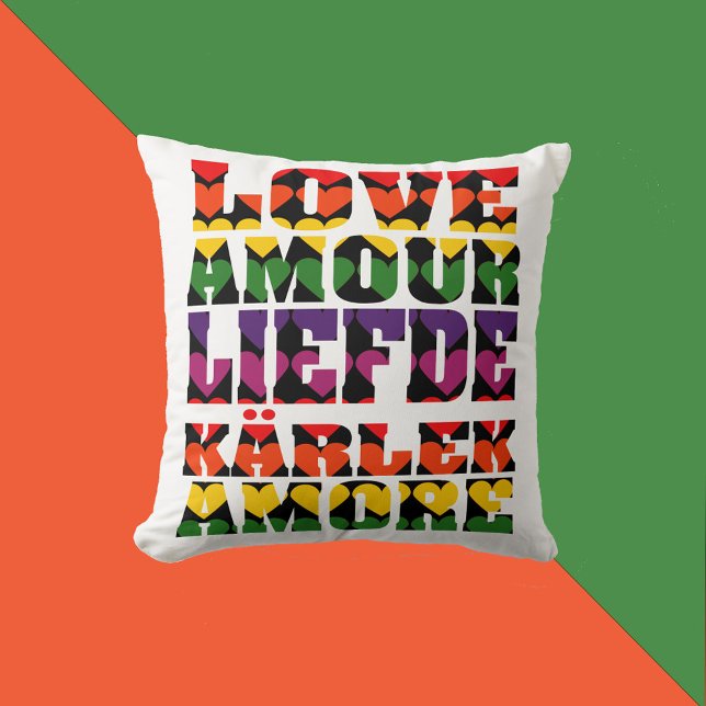 Liefde in verschillende talen Heart Dark Rainbow Kussen (A throw pillow that says love in English, French, Dutch, Swedish and Italian with rainbow hearts.)