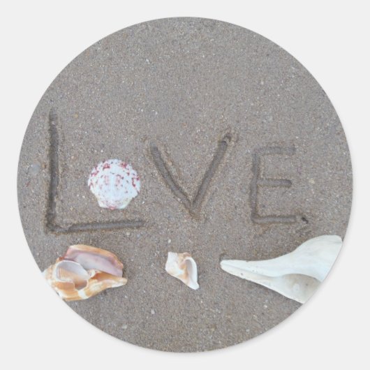 Liefde op het strand met zeeschelpen ronde sticker (Voorkant)