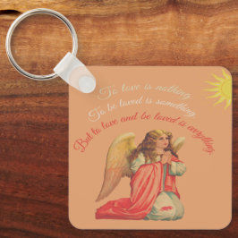"Liefhebben en bemind worden is alles". Sleutelhanger