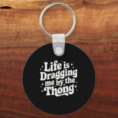 Life Is Dragging Me By The Thong  Sleutelhanger (Voorkant)