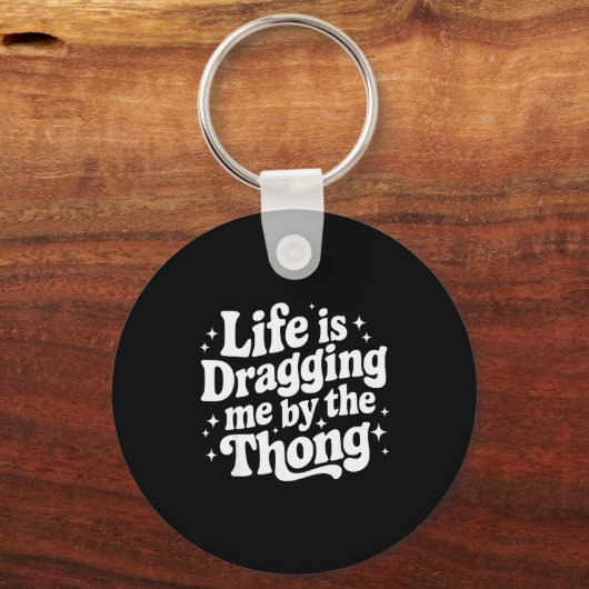 Life Is Dragging Me By The Thong  Sleutelhanger (Voorkant)